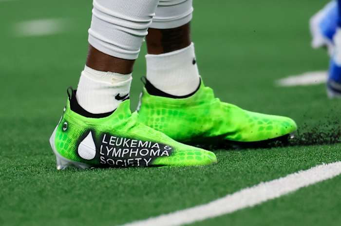View of lime green cleats.